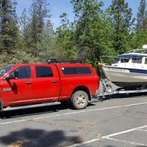 The big red rig,
1 ton diesel, perfect for the R25 Tug but overkill for a CD 25 but decent towing mileage (between 12 and 16 depending on the terrain) and will crest any pass at the speed limit (900 ft lbs of torque)and only need the exaust brake all the way down.(heavier duty trucks may have the same engine power as lighter dutys but have WAY more powerful brakes, and on this truck I have seen up to 90hp of exaust brake hold back and will hold us to under 60mph on the steepest downgrades with the CD25) also only the 1 ton comes with the Aisin trans that won't overheat when towing.