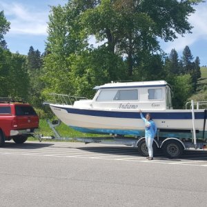 Media 'Dana in Wyoming with Andiamo on the way home from her purchase in South Dakota June 2018. Prior to 15 she had been a New England boat. We traded the 03 135 Honda for new Suzukis at Sportcraft in Oregon.' in album 'The big red rig,
1 ton diesel, perfect for the R25 Tug but overkill for a CD 25 but decent towing mileage (between 12 and 16 depending on the terrain) and will crest any pass at the speed limit (900 ft lbs of torque)and only need the exaust brake all the way down.(heavier duty trucks may have the same engine power as lighter dutys but have WAY more powerful brakes, and on this truck I have seen up to 90hp of exaust brake hold back and will hold us to under 60mph on the steepest downgrades with the CD25) also only the 1 ton comes with the Aisin trans that won't overheat when towing.'