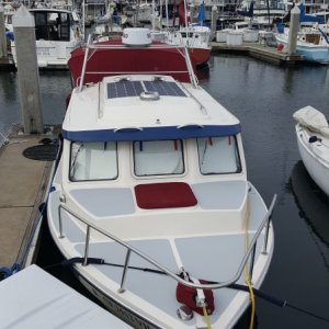 Our new eyebrow handholds, 220 watts of solar, new Lewmar windlass and 22# Rocna anchor. Dana had all new Sunbrella done along with all new interior upholstery and v-berths.