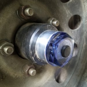 New oil bath  kodiak hubs instead of the old grease through spindle system, you can see the oil level, they should be much less maintenance and more reliable. I just ordered Lucas hub oil for my emergency trailer box just in case. My last trailer had a different system that was bulletproof this one is new and has mixed reviews on the rear seal so I have a complete spare set.
Stay tuned for a review. 
(Oil bath hubs are used on high mileage semi-trailers)