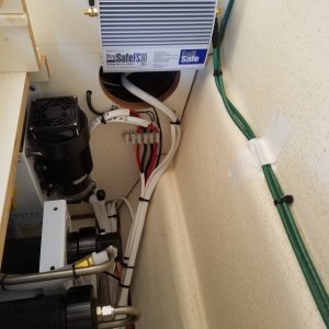 Just installed this ProMariner, ProSafe galvanic isolator which of course should have been my first project not one of the last as this harbor is eating my zincs. It separates the 110 shore power ground small voltage leaks from other boats in the harbor. You can also see the back of the watermaker Clark pump and its pressure feed pump.