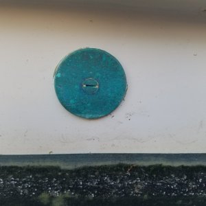 This is a bronze cap I made with a hole saw over an old air conditioning thru-hull I removed, a very easy solution to covering the hole. It has a slightly larger square plate on the inside, the countersunk bolt is silicon bronze. Absolutely don't use brass!! Too much zinc in the alloy and it will suffer from "dezincafacation" in salt water.