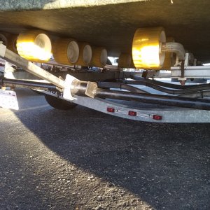I made a steel pipe cross bar that has 20\" steel straps that slide up into the trailers tubing, now the outboard brace has a solid place to sit on.