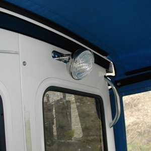 (rogerbum) 3000 candlepower spreader light.  Mounted off center to 1) avoid collisions with head and 2) allow it to shine over my shoulder while cutting bait.