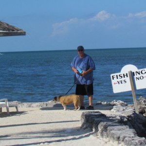 me and deputy dog Lucy out at the beach Black Fin Resort Marathon, a barbecue grille and tables steps down into the water 200 yards from our boat slip.