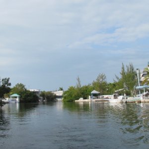 The canal leading in and out of the Pilot House Marina in Key Largo nice homes and boats.