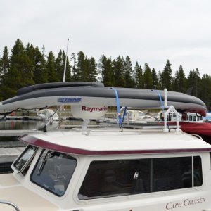 The rack is desined to keep the kayak parallel to the boat.  By doing so the stern does not wear on the bimini, nor does the kayak act like a parachute and catch the wind.