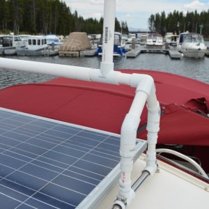 The center bar between the 2 uprights is one within another, adding strength as well as allowing the outside one to roll freely as the kayak is moved into place.