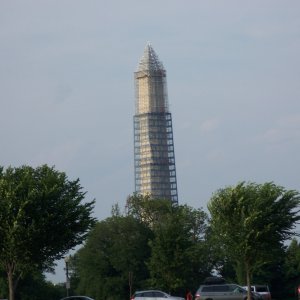 Washington Monument, being repaired due to earth quake, viewed from Potomac River