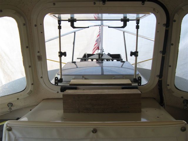(014 14) Window brackets disconnected and standing vertical to hold window open.  Blocks in place for AC to sit on.