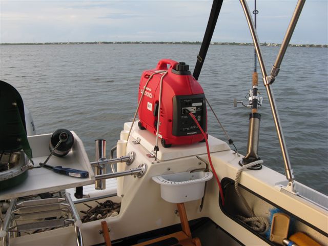 (021 21) My Baby!  EU1000 Honda bungeed to Port Lazarette with extension cord through cabin bulkhead.  About 6 hours between refills.