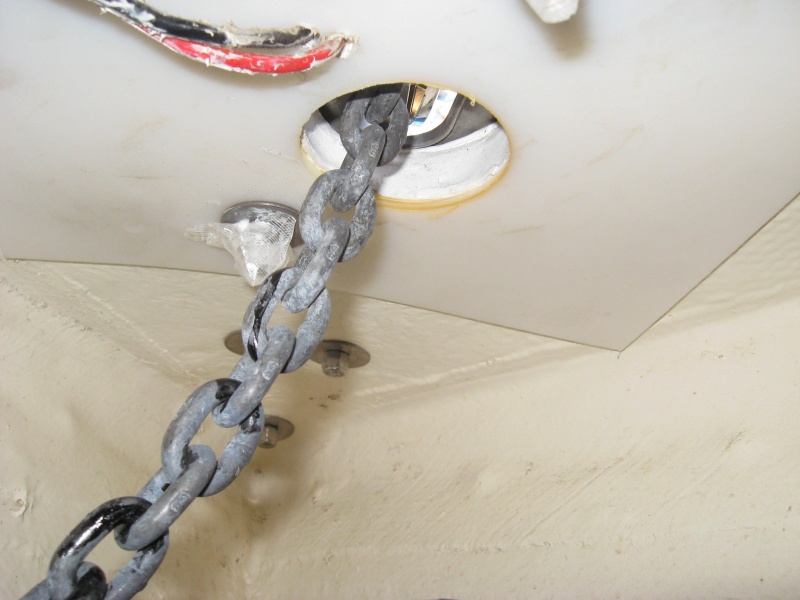 1/4 inch 12x12 UHDW plastic backing plate windlass load is in shear so maybe overkill but maybe not.  lewmar provides 3/8 washers, not even fender washers