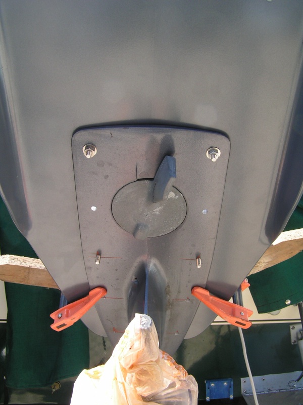 1/8 inch pilot holes are drilled first from underside, then 1/4 inch holes.