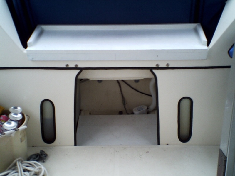 1.  Table/bench seat fits over transom.  Made from scrap PVC planks.
2.  Scrap PVC planks cut to fit over raised edges of bilge area.  This allows use of bilge area w/o stowing any gear in water