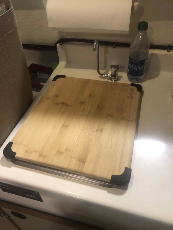 (16" x 14")Cutting board to cover sink, fit perfectly and comes with rubber feet so it doesn't slip.  Cost $19.00