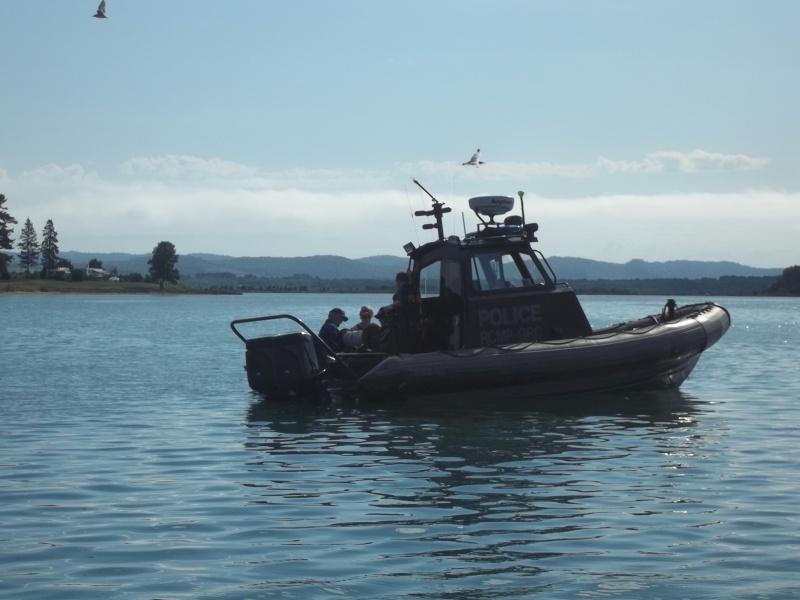 18/08/2011...RCMP Marine Division hard at work talking to a Perch fisherman in his 12 foot boat.You can see the guy and his wife in the bottom left of the picture.