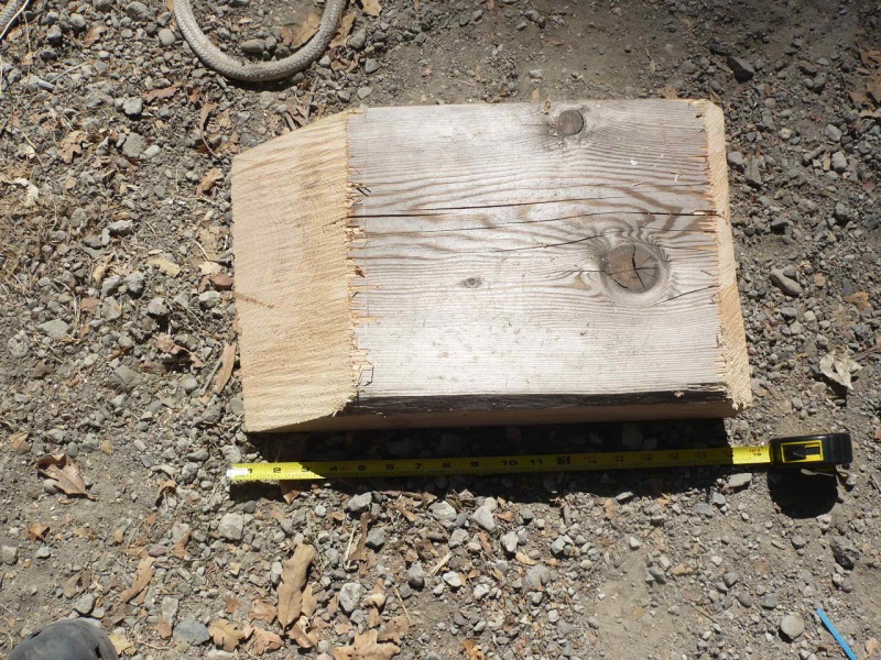 18" chunk of 4x12 (easily cut with chainsaw) makes a great drive on for changing a flat tire on a tandem. Doubles as chock. Considering driving a couple screws completely through the tapered edge so it will get a bite on pavement and not slide as easily on drive up. At 18" it will just fit between tires for forward drive on with any tire.

Other parts of the trailer travel box are: Fitting tire iron; 1 complete bearing/hub/seal kit; a second set/bearings only and races; spare bearing buddy and small grease gun; ir thermo; spare lights; tools for removing a hub; paper towels/orange gel/disposable rubber gloves; Small tarp to sit on; flares and safety reflector;trailer wiring circuit tester; chain/spare ratchet strap tie downs (for temp. emergency repairs). Please add other suggestions in comments.