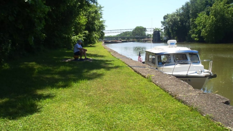 21.) Waiting at lock wall for barges to exit lock to go clear the tree.