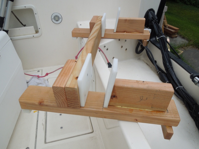 2x4s, a little glue, some self-tapping deck screws, left over cutting table material, and a few coats of spar Varathane.