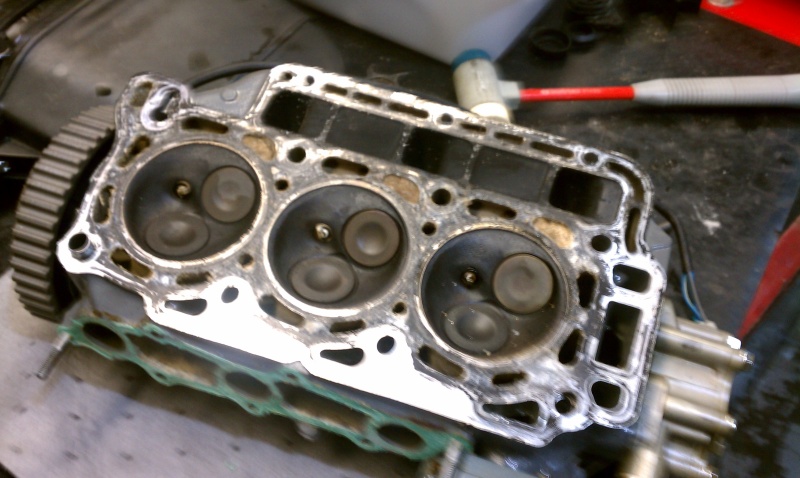 3 cylinder  40hp  honda new head gasket and carb cleanout