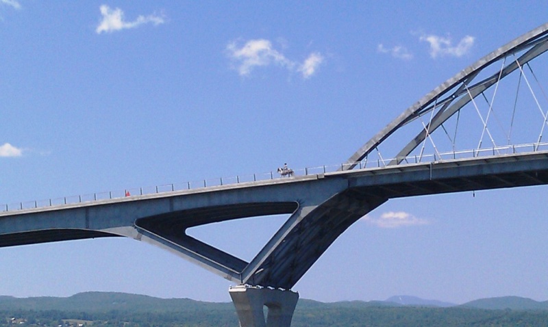 31.) Yes, that is a horseback rider on the bridge.