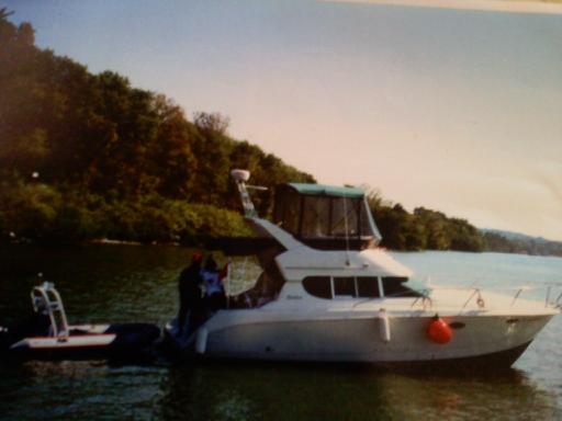 312 silverton "Livin' The Dream"
towing our dinghy, at anchor waiting to lock thru. we sold this boat and purchased the 2000 carver