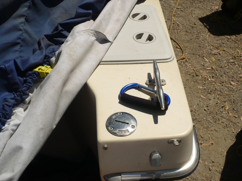 6-7" aluminum foam grip clip on carabiner (see next photo) makes an excellent hand hold, clipped on rear cleat for emergency crawling into boat . This is especially true if the boat is equipped with Permatrim. I leave it there permanently.