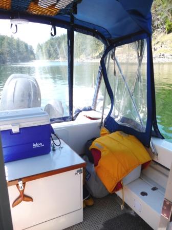 8. The side window unzips and folds back to attach with velcro to the top of the window aft.