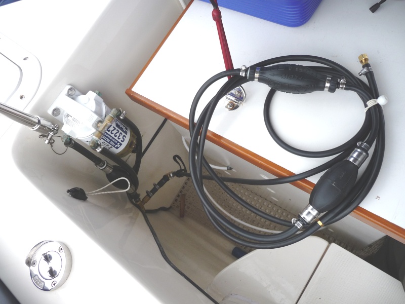 8. This quick connect line pump has a male "Yamaha" fitting on one end and a screwed on stopper on the other end. We can now pump fuel from either tank and have the volume measured by the fuel management meters. We use this to fill our 1000 Watt "Honda" Generator and our 2 hp "Honda" tender motor. Now we don't need to carry a portable fuel container on board. We could also pump fuel to someone else if need be or empty our tanks.