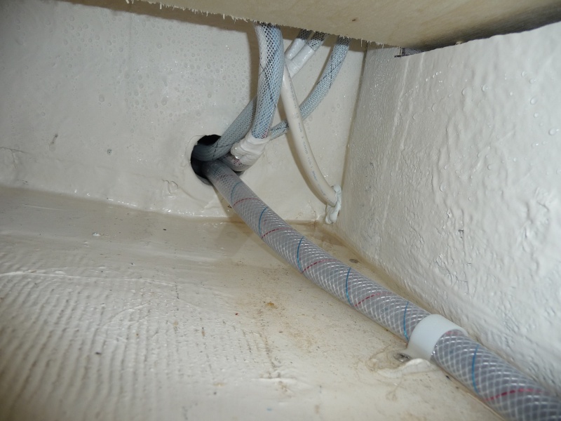 9. Wires and water line on the starboard side, under the 2 drawers, under the Wallas Stove, feeding into the chase below the cockpit floor across to the stern end of the water tank on the port side.