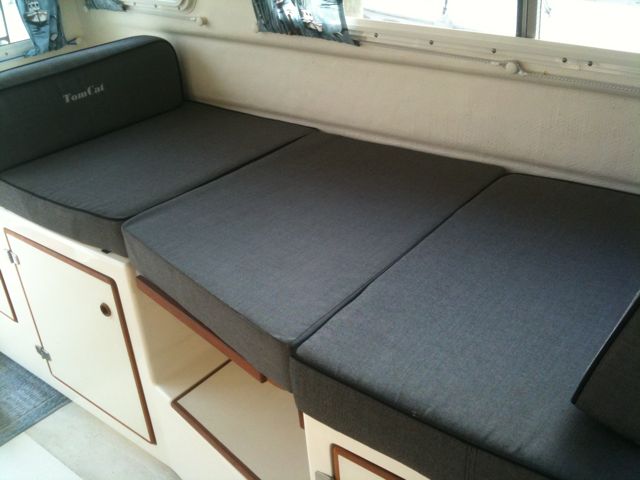 A cushion I had made to fit the oddly shaped table. More comfortable for sleeping and sitting than the supplied rectangular cushion!