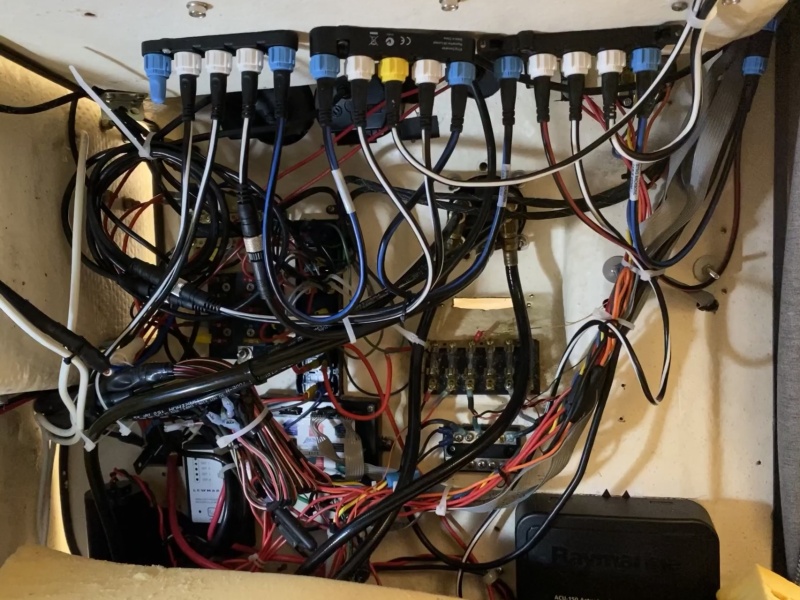 A lot of electrical packed into a small area, so only so much can be done to clean up this rats net. Upper part of photo shows Nmea 2000/seatalk network.