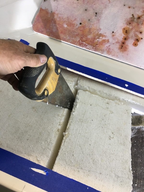 A small hand saw turned out to be the best tool for removing the styrofoam.