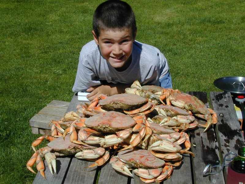 About an hour later, Mason with cooked crab(Mason C. Bailey)