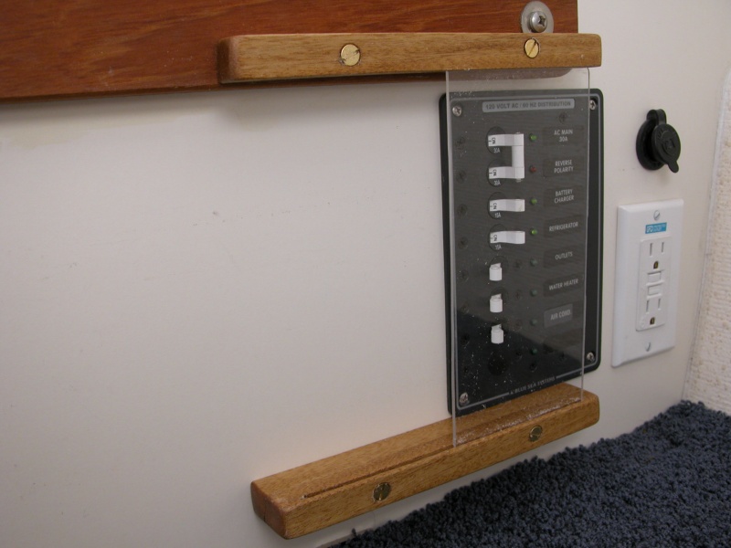 AC Power Panel cover_'b' view.  Plexiglass height was chosen for:  lower slide to be as high as possible to allow door under carpet to open as far as possible,  not to have slide cover any part of the power panel and  keeping the bottom circuit breaker blank space clear for a future addition.