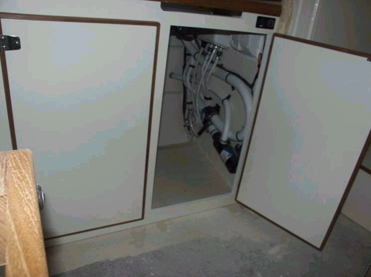 Access to plumbing (hoses, Y-valve, macerator and more). 3/15/04