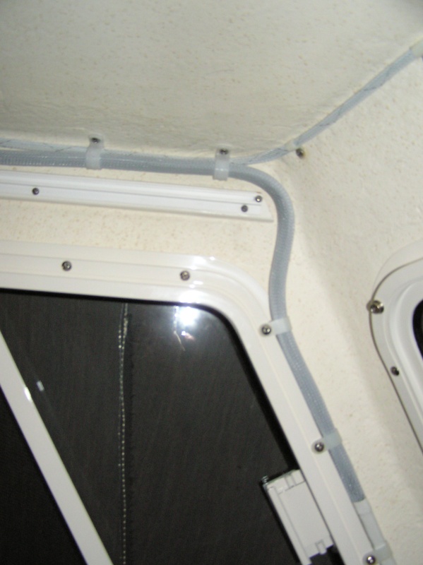 Across the roof line and down the "A" pillar then into the V-berth to the power & 740S unit.