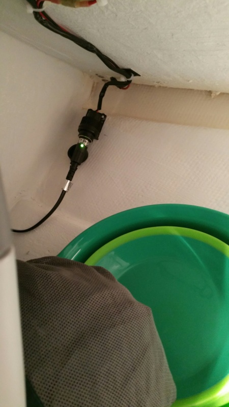 Added a power outlet in back corner of storage space for the standard 12v Engel freezer DC power cable