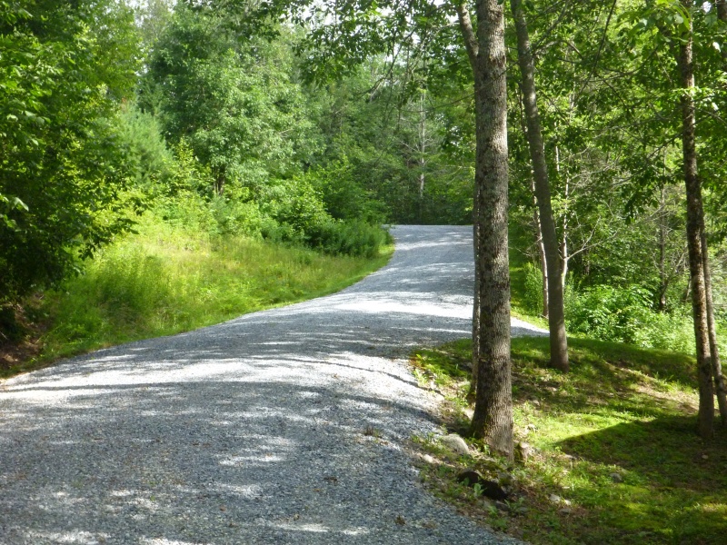 After coming down this driveway I had to launch here. I don't think pulling the boat back up around the corners would have been possible even with four wheel drive as it is gravel and steeper than this picture looks the switchback is at the top of the picture and goes sharply to the left. I think a two wheel drive truck might have trouble getting out with out a boat and trailer
