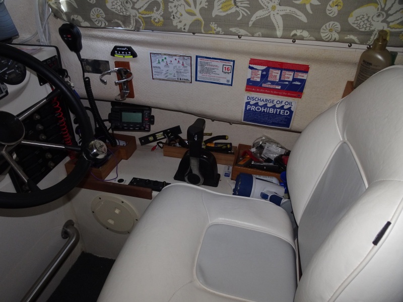After market helm seat.  also note the windshield wiper control close by, the boxes in the background for often used tools and other items.