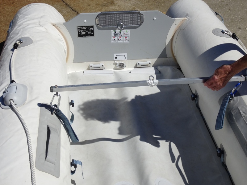 Aluminum square tubing with 5/8" dowel epoxied into middle. This has two sets of Carabiners.  The outer for lifting the dinghy with the Davit, and the inner for hoisting the window air conditioner inside of the cabin into its position.