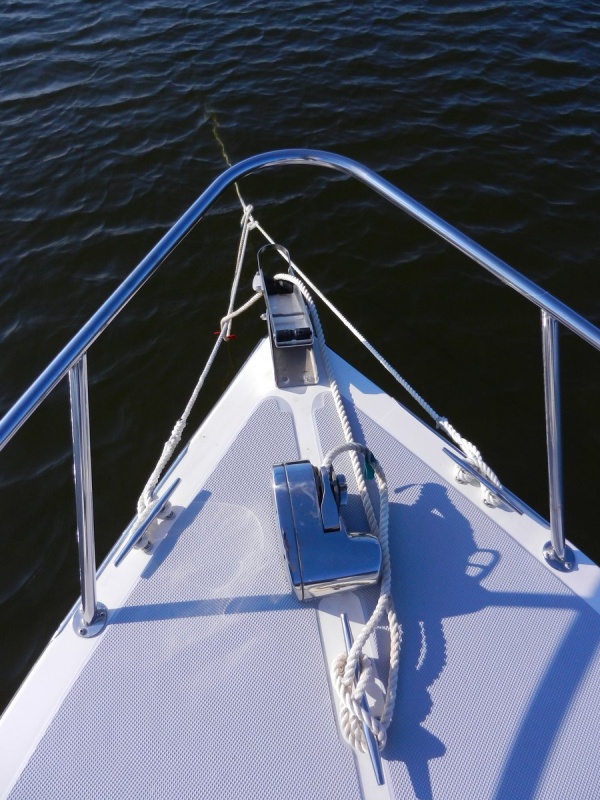 Anchor rode still attached to center cleat as backup