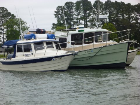 Anchored and rafted up the Ranger tug has a 25 pound Rockna so we just let him do all the heavy lifting with his windless, we are probably in about 6 to seven feet of water here at low tide. Short dink ride to town, very quiet here, except for the tree frogs at night.