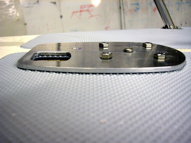 (AnchortownJim) Quick ASTER 500 mounting plate made out of 3/16" 6061 aluminum, prior to being epoxied to the deck with MarineTex, side view.