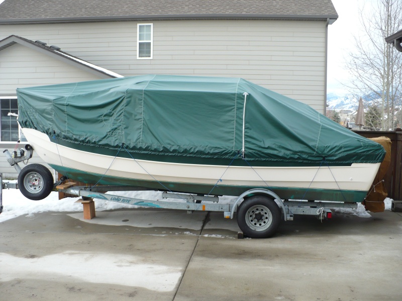 Angola Cover with side zipper. Be sure you order it where the motor is covered too. We get about 150" of snow and it all gets dumped into the motor well unless you have the motor cover. Also, they need to add about 6 inches to the sides so it covers more of the boat/stripe.