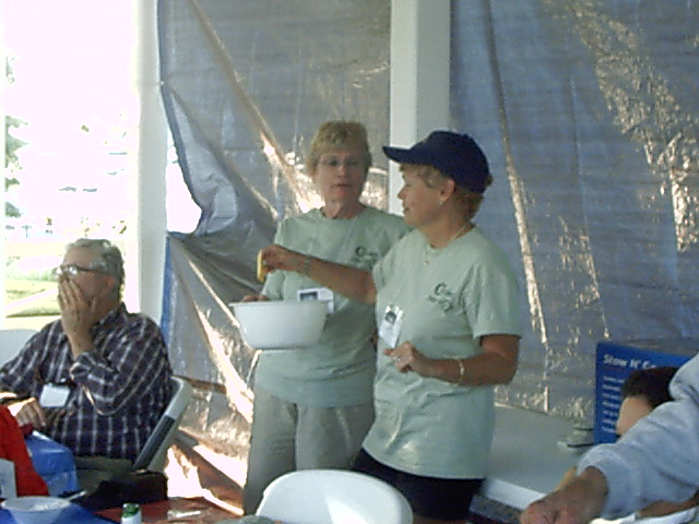 Anne and Margo picking prizes
