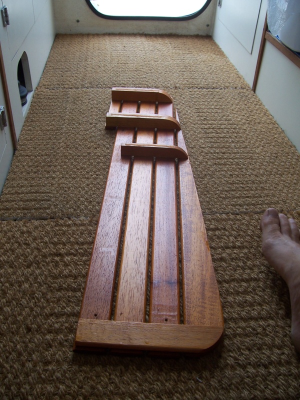 Another angle. The ribs step up in height, to allow for the sloping floor. It makes for a flat floor in the Head. Three screws hold each outside piece to the center. The two wings are removed, and then the center is lifted out.