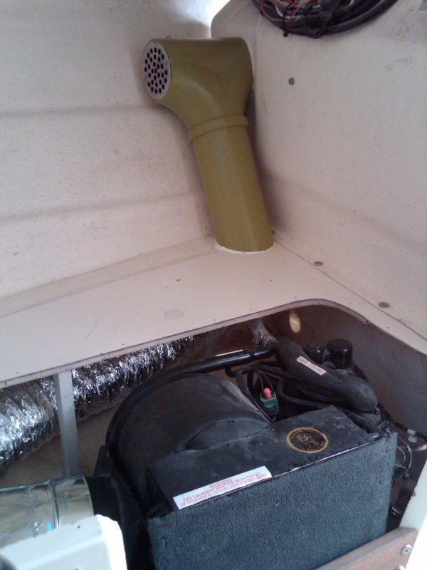 another view of AC with PVC pipe exposed duct and grille (replacement shower strainer)