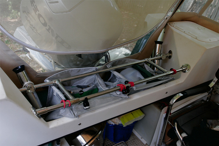 Another view of transom bar storage. Folding coleman chair fits over porta potti to save space.