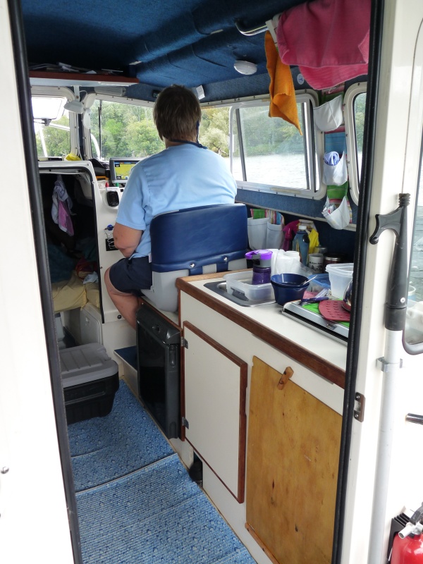 Another view of Two bears in travel mode.  The plastic box on the floor stores "chips" and as a foot stool for our feet when sitting sideways at the dinette and facing sideways/ forward.